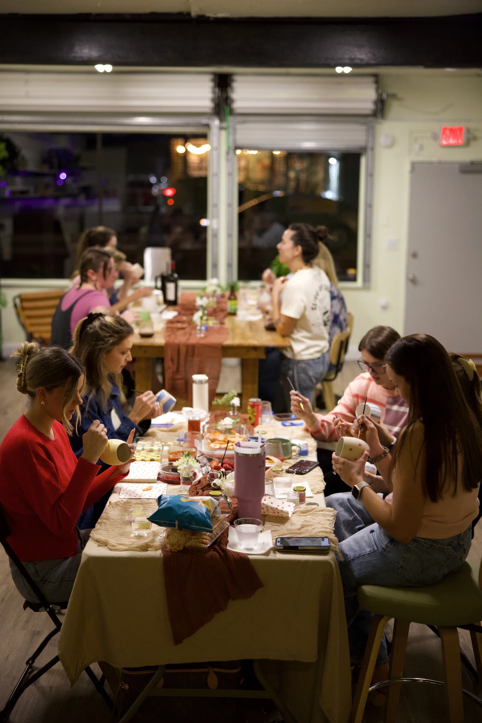 Friends at a private Paint & Sip party at Floridian Ceramics