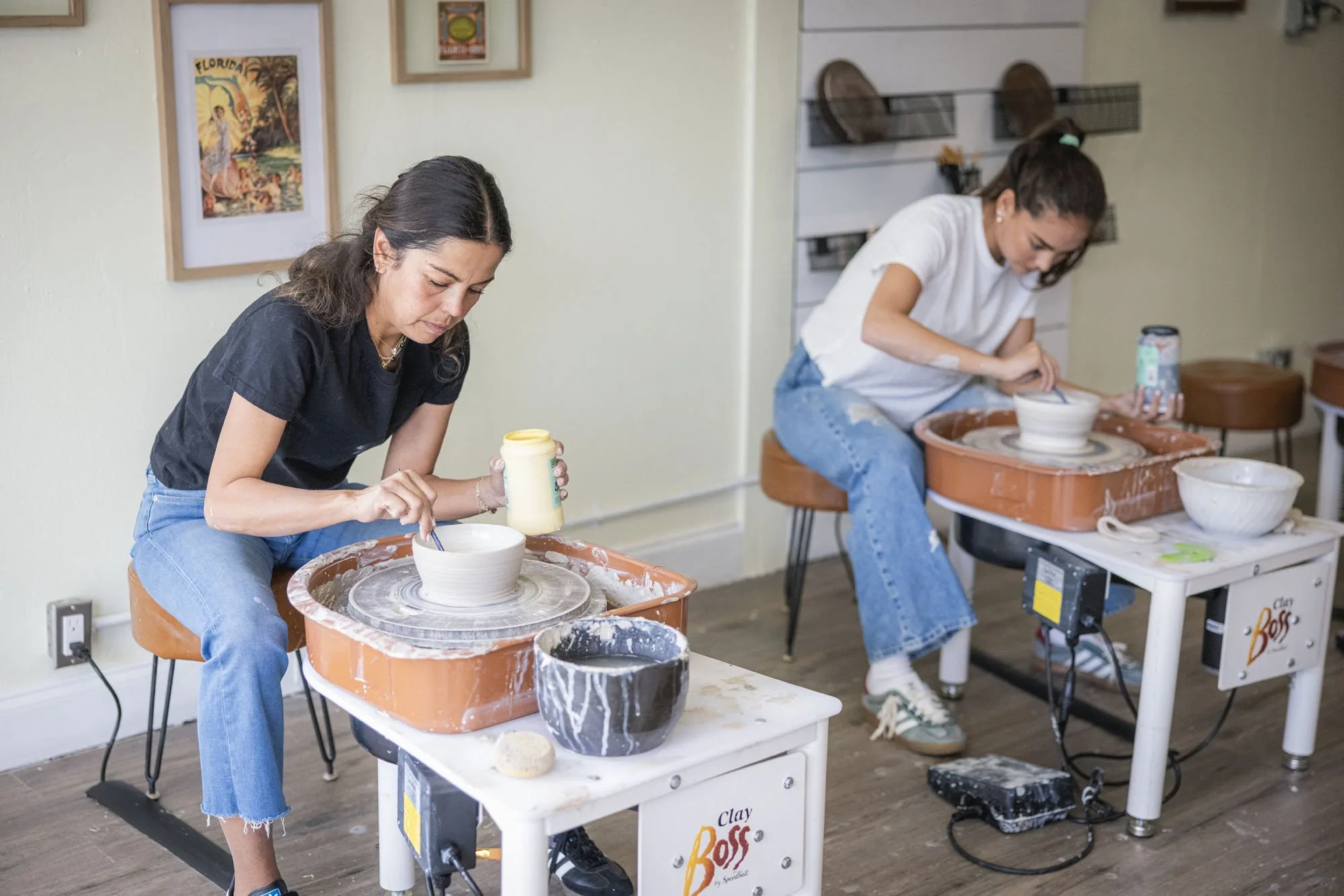 Student shaping clay on the wheel at Floridian Ceramics in Tampa